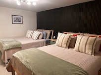 Second room with two beds and private bathroom