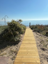 Boardwalk directly from the deck to the beach.