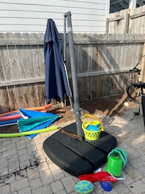 Main pool umbrella that was not usable and needs to be removed and replaced