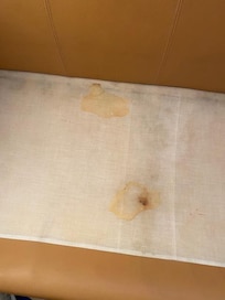 Horrible stains under the sofa cushions