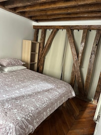 Bathroom is behind the curtain from bedroom #1