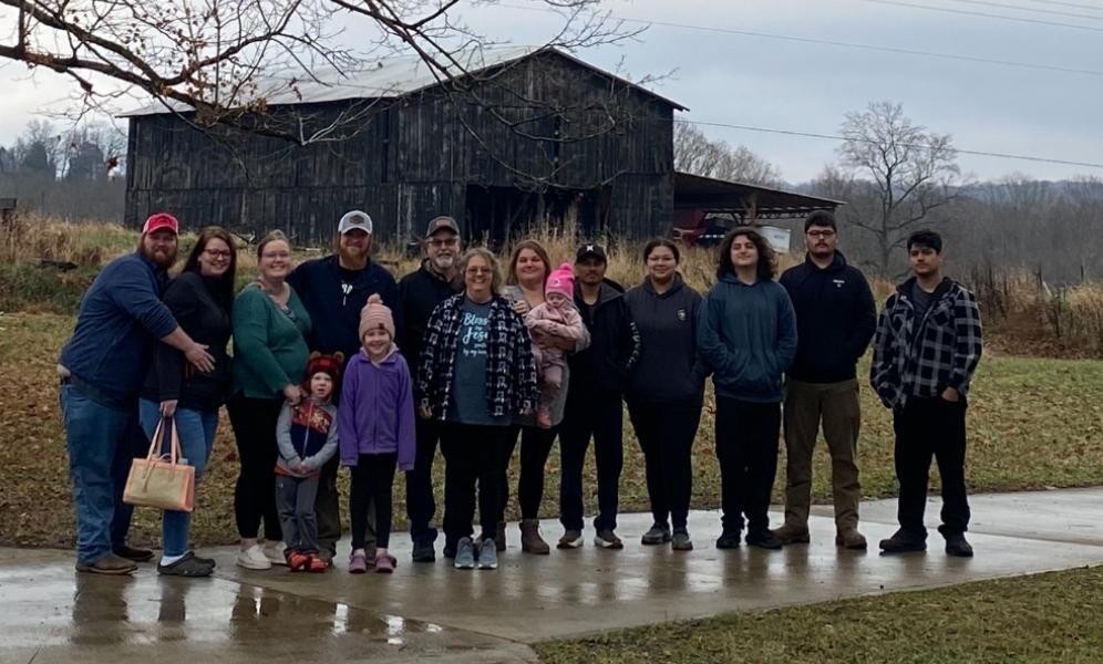 Our family with the beautiful old barn across the road 