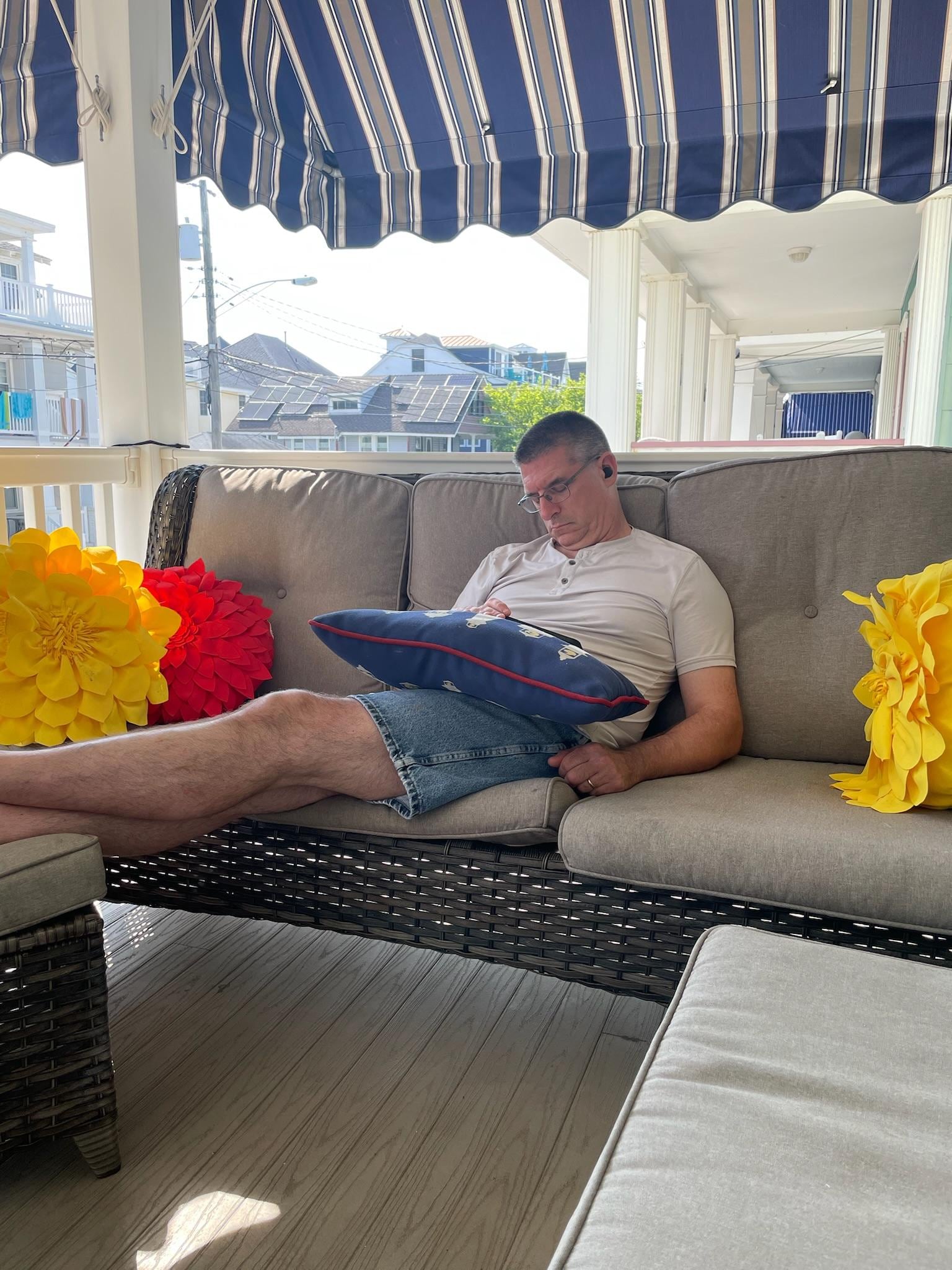 My husband enjoying the front porch! 