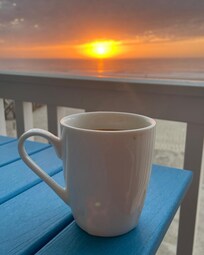 Morning sunrise from the deck with coffee.