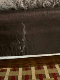 Brown slip to cover box spring.