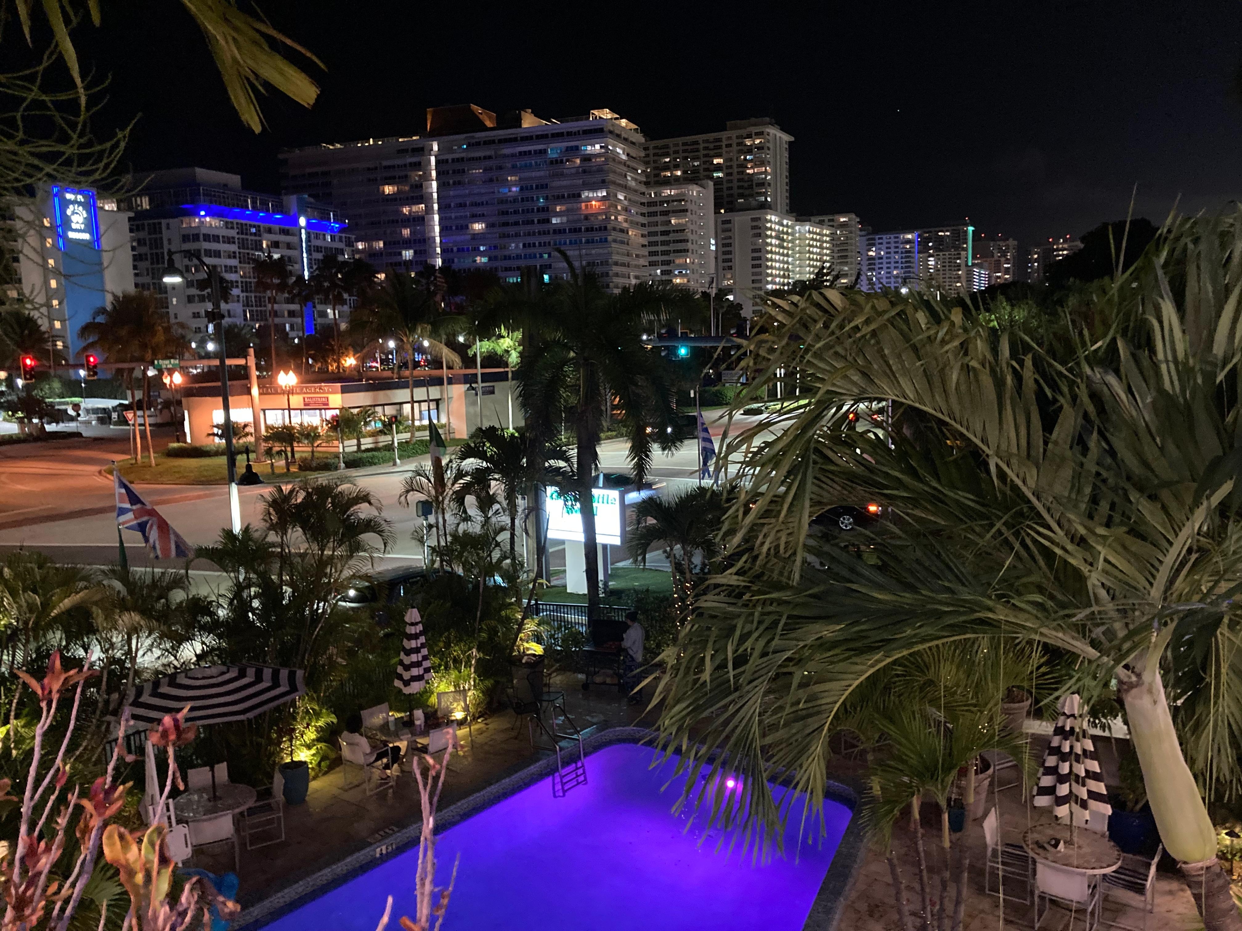 Evening view of pool and surrounding area.