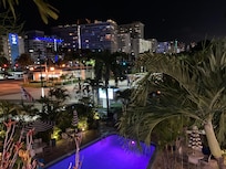 Evening view of pool and surrounding area.
