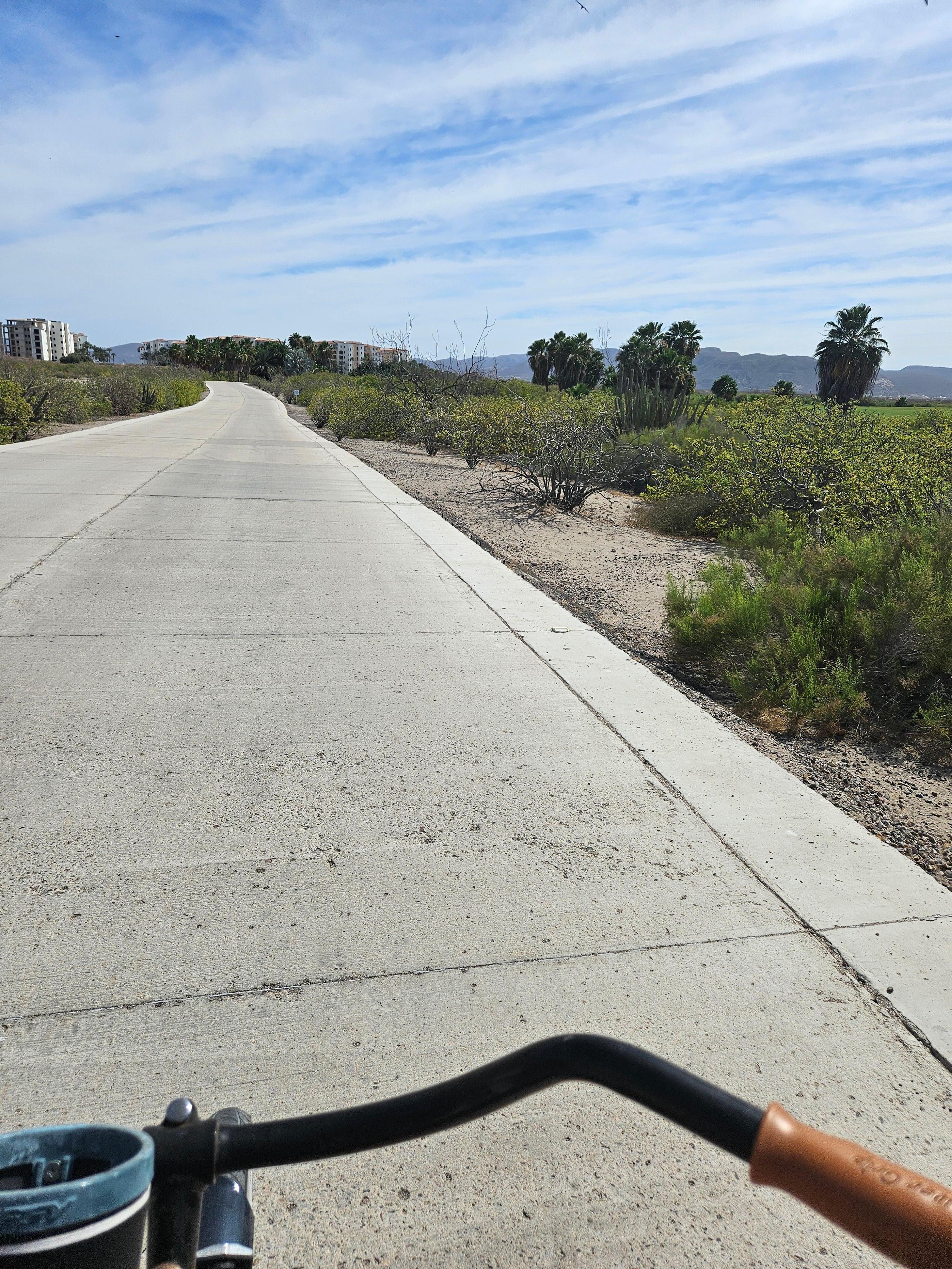 Bike ride between golf course and condos