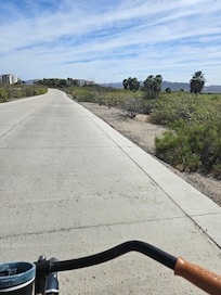 Bike ride between golf course and condos