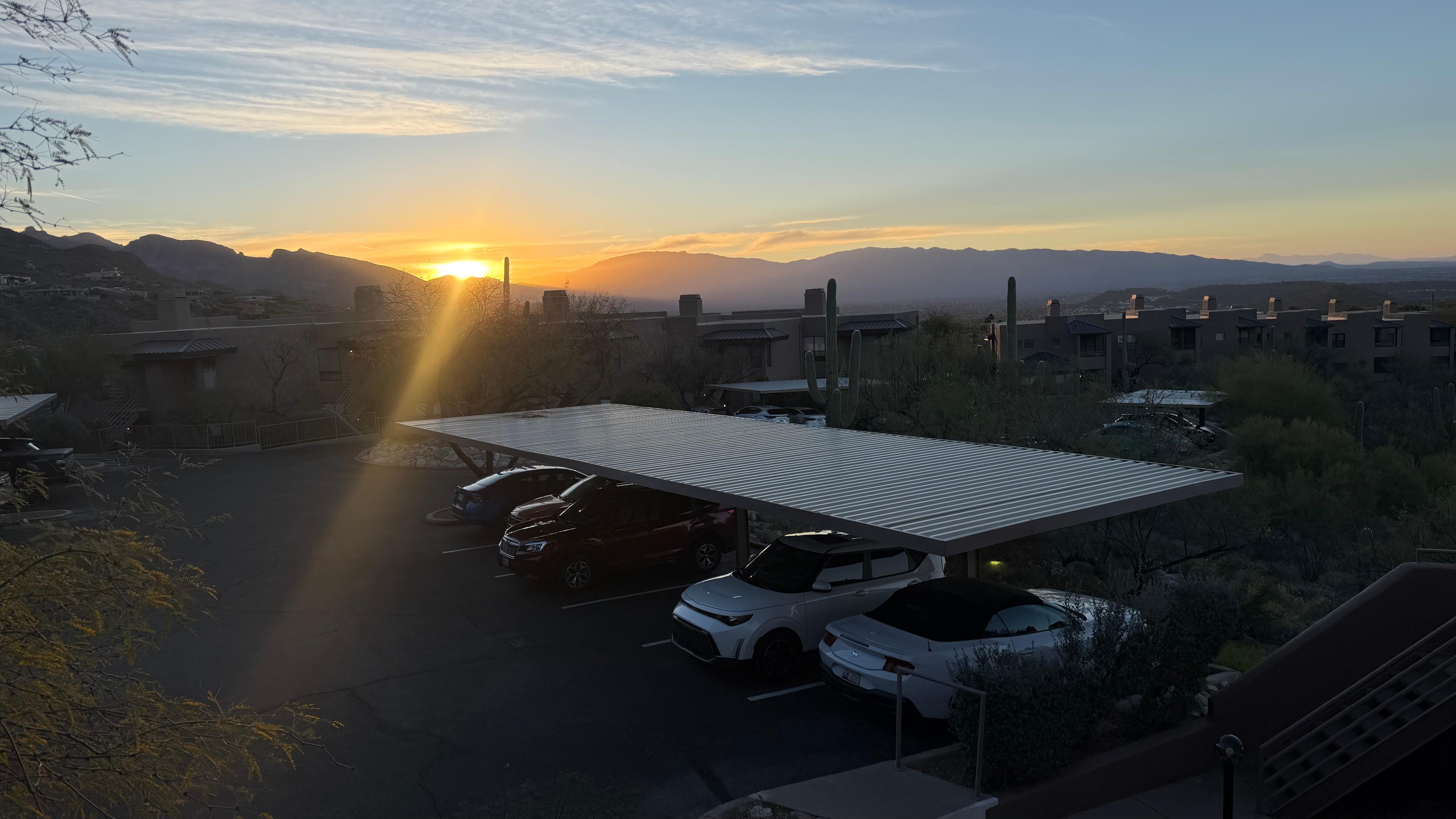 Morning sunrise from front door stoop. Parking space is closest one