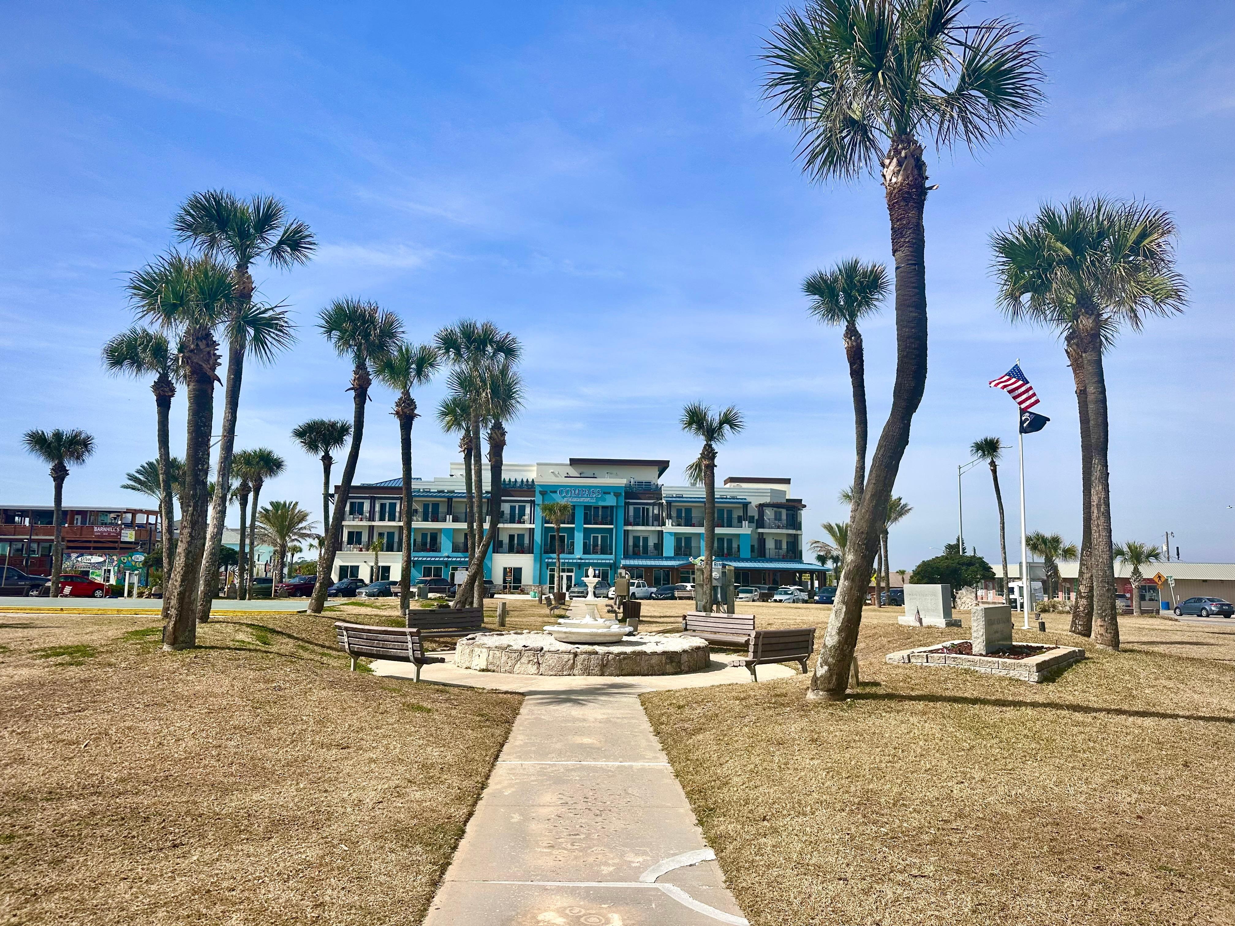 Standing at the beach looking at the place.