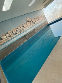 Indoor unheated pool with green staining