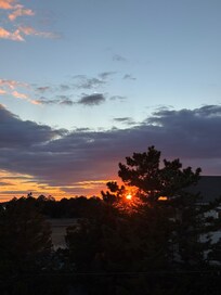 Sun sets are behind the house to the west.