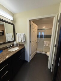 Clean bathroom with everything you need! Fully stocked with DOVE brand shower needs. Very cool!!