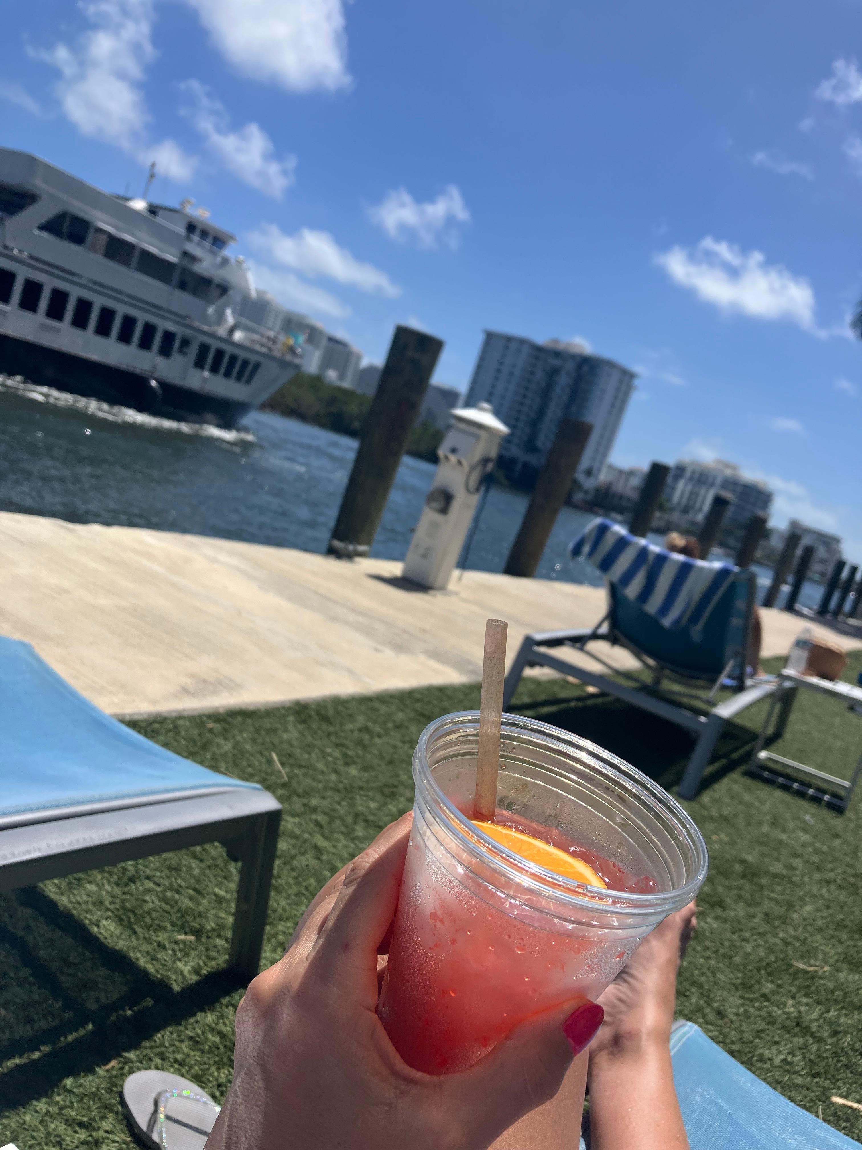 Sitting on lounge chair by water was beautiful 