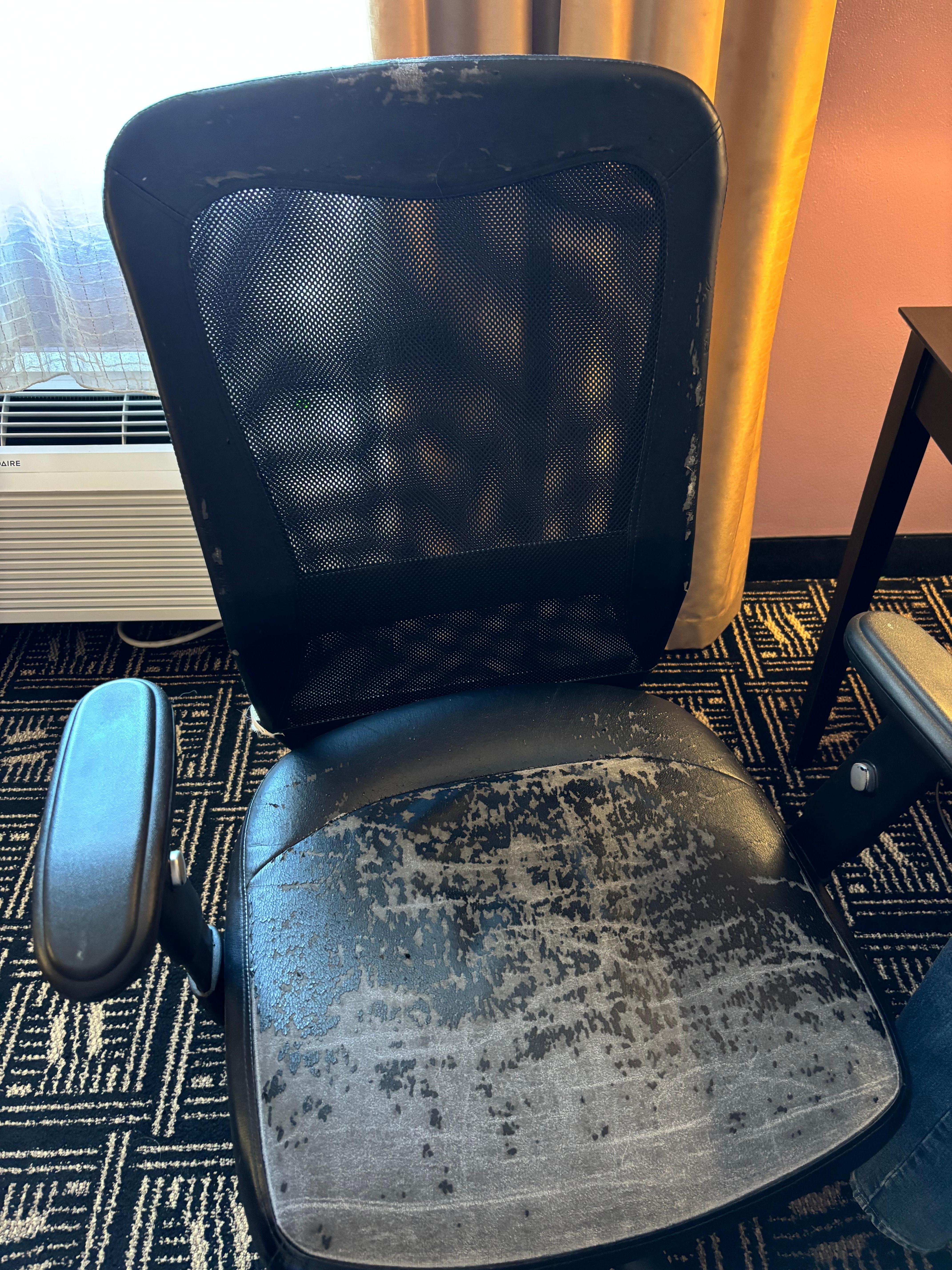Desk chair flaking black on anything near it
