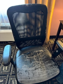 Desk chair flaking black on anything near it