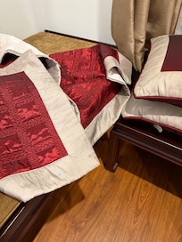 Stains on cushion and runner which was laid on the bed