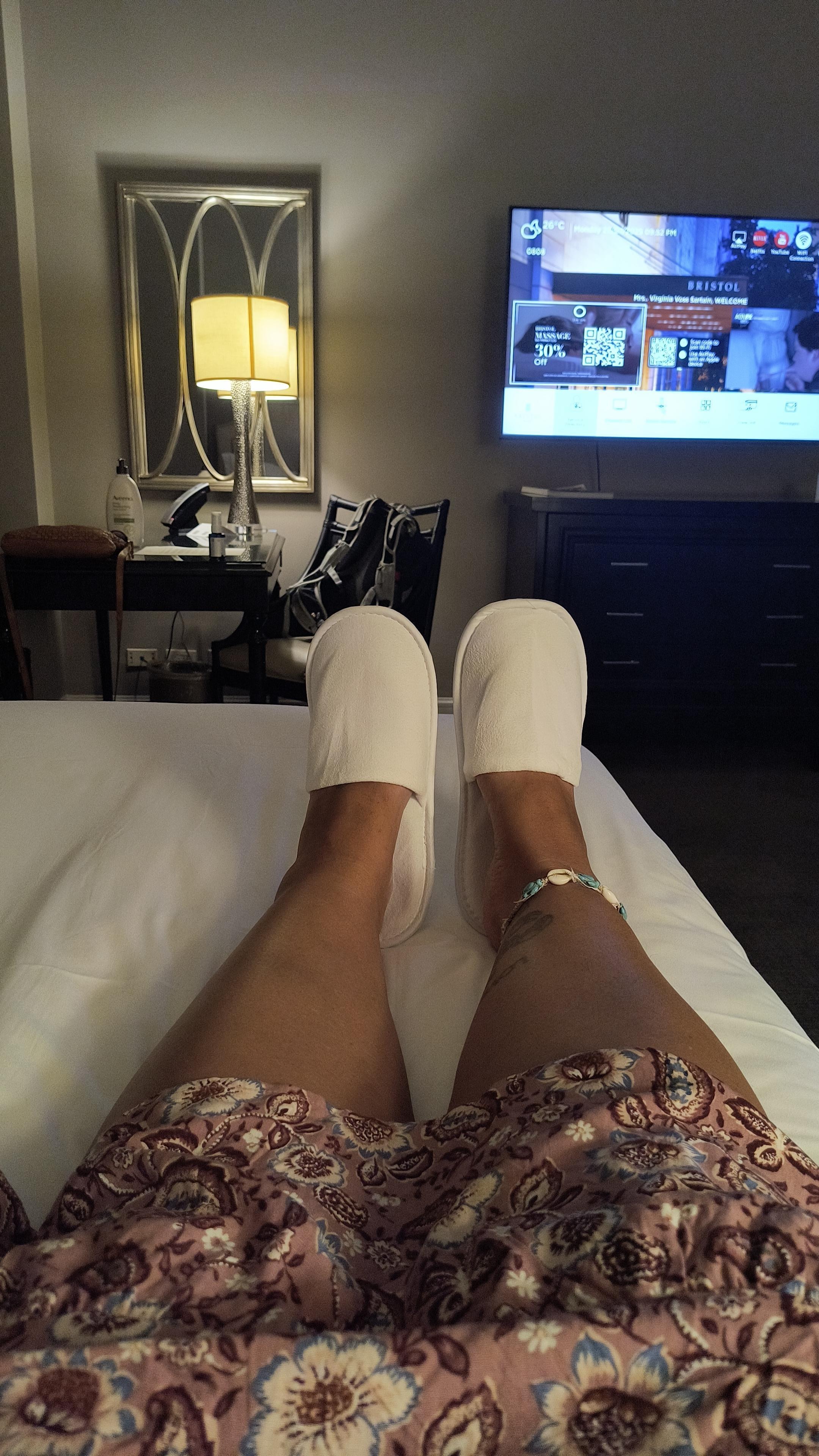Relaxing after a long day with hotel provided comfy slippers