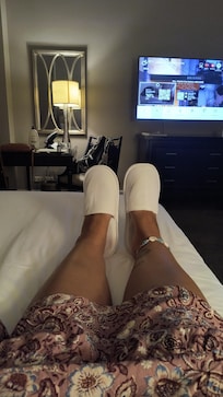 Relaxing after a long day with hotel provided comfy slippers