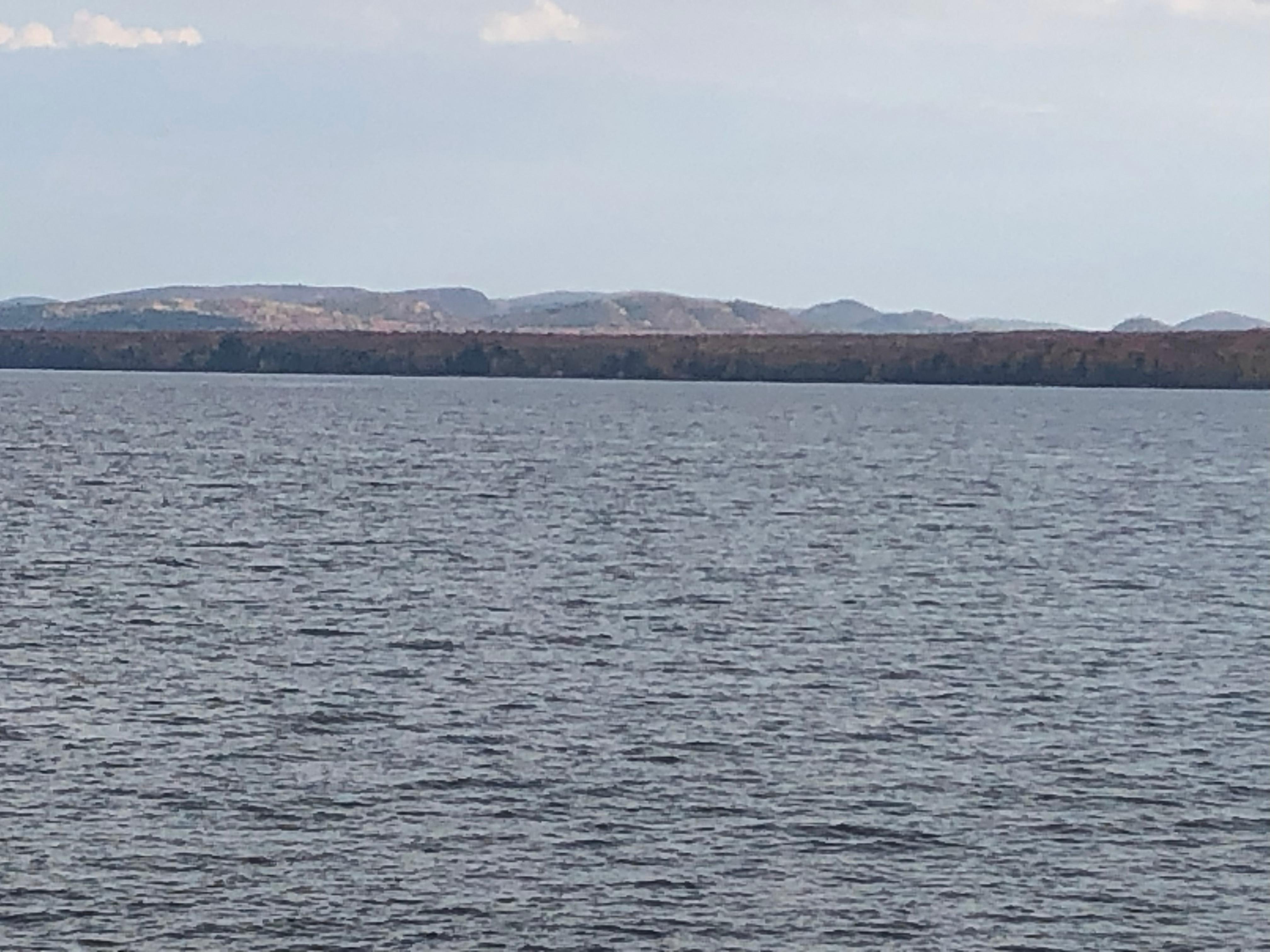 Best view of the Huron Mtns you can get aside from standing atop one. Know site is not a traditionally prepped/graded/grassy plot (yet!). It's a forest floor with large enough flat areas for 3-5 tents of max 3 person capacity. It's maybe 2 acres tota