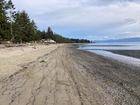 view from beach below resort looking north to Rathtrevor park