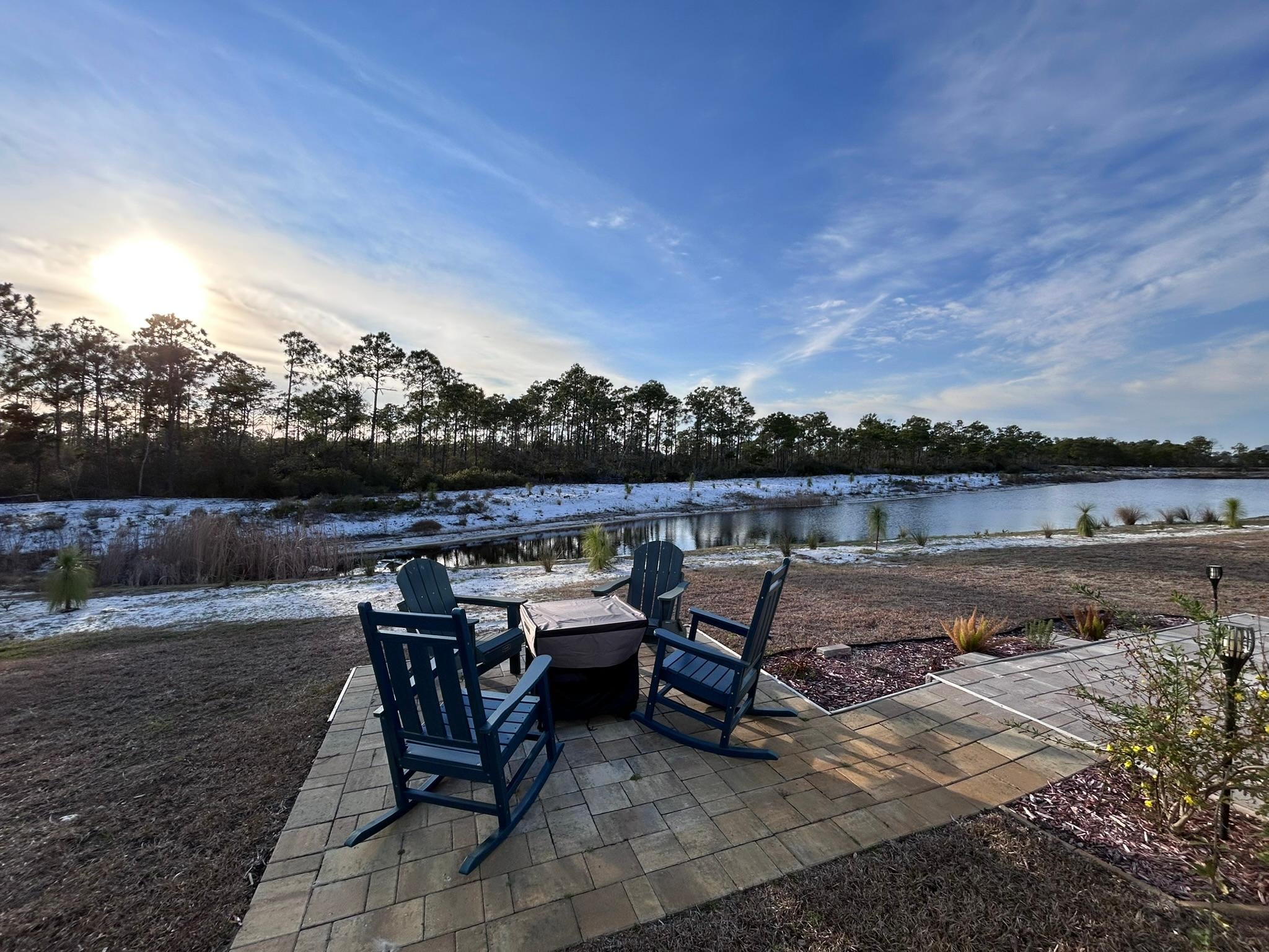 Backyard firepit area with a peaceful setting