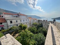Blue strip awning is terrace - photo taken from wall walk