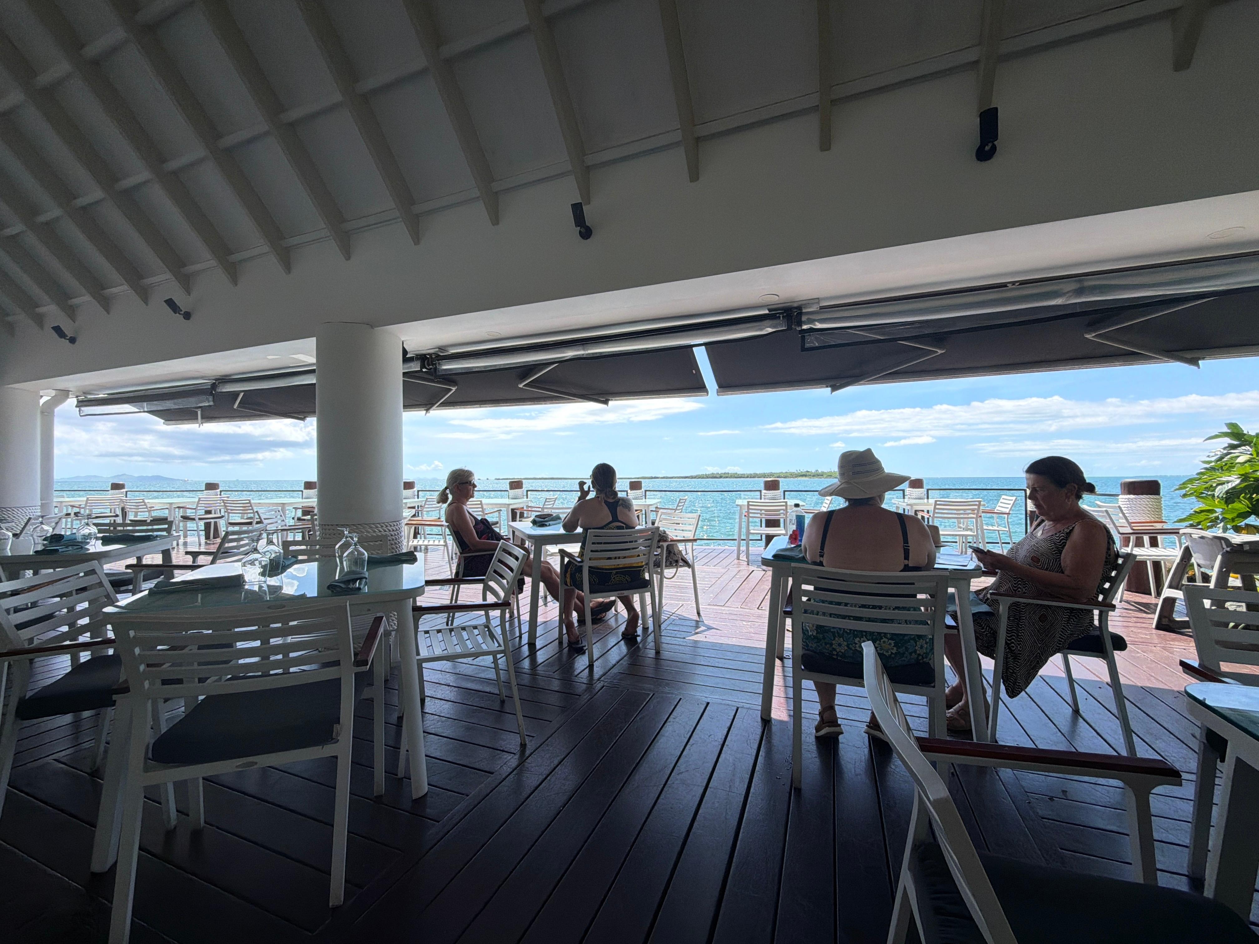 A restaurant along the water at the hotel 