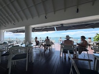 A restaurant along the water at the hotel