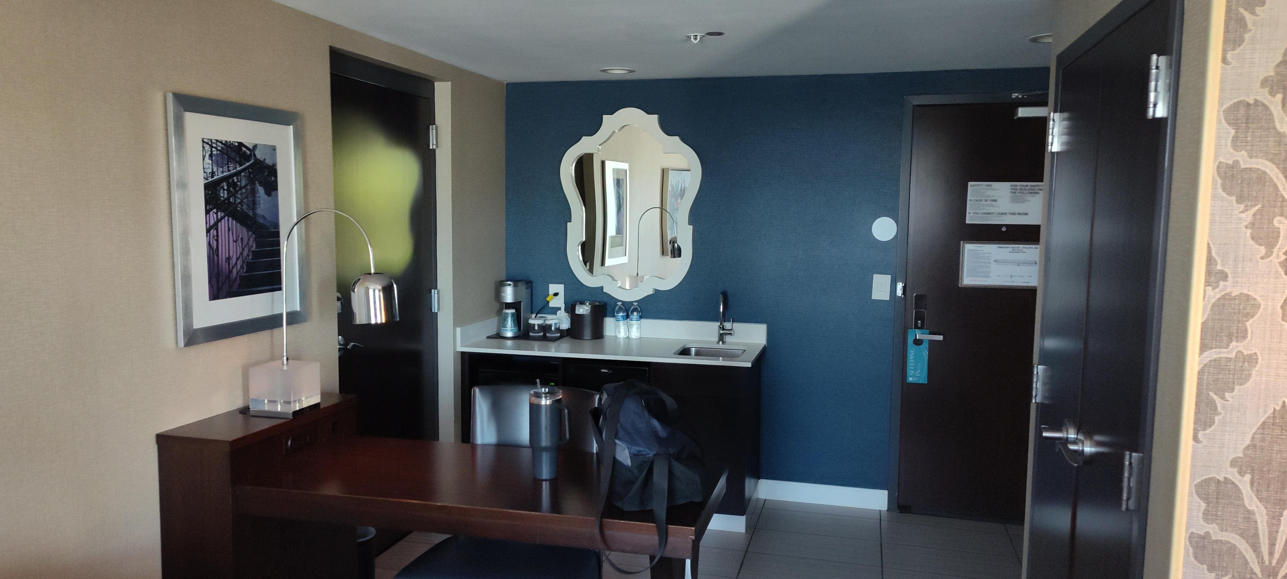 Office area, refrigerator, coffee maker and sink