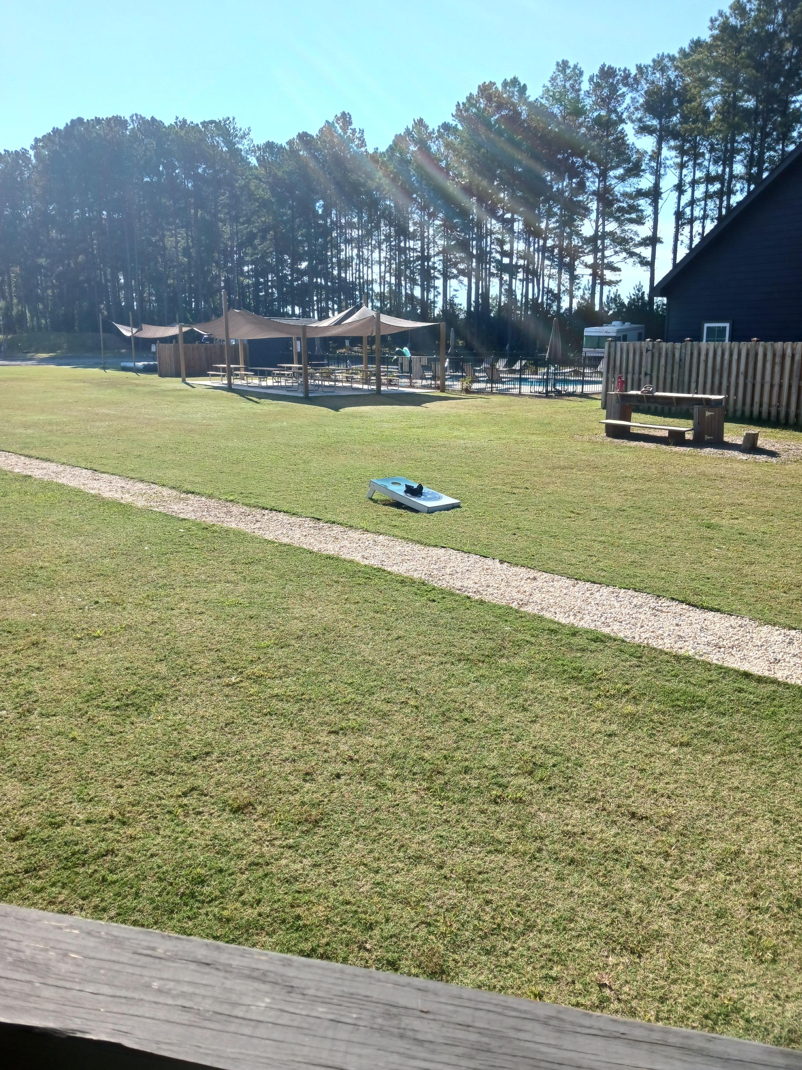 Looking at pool, picnic area from cabins porch.