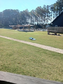 Looking at pool, picnic area from cabins porch.
