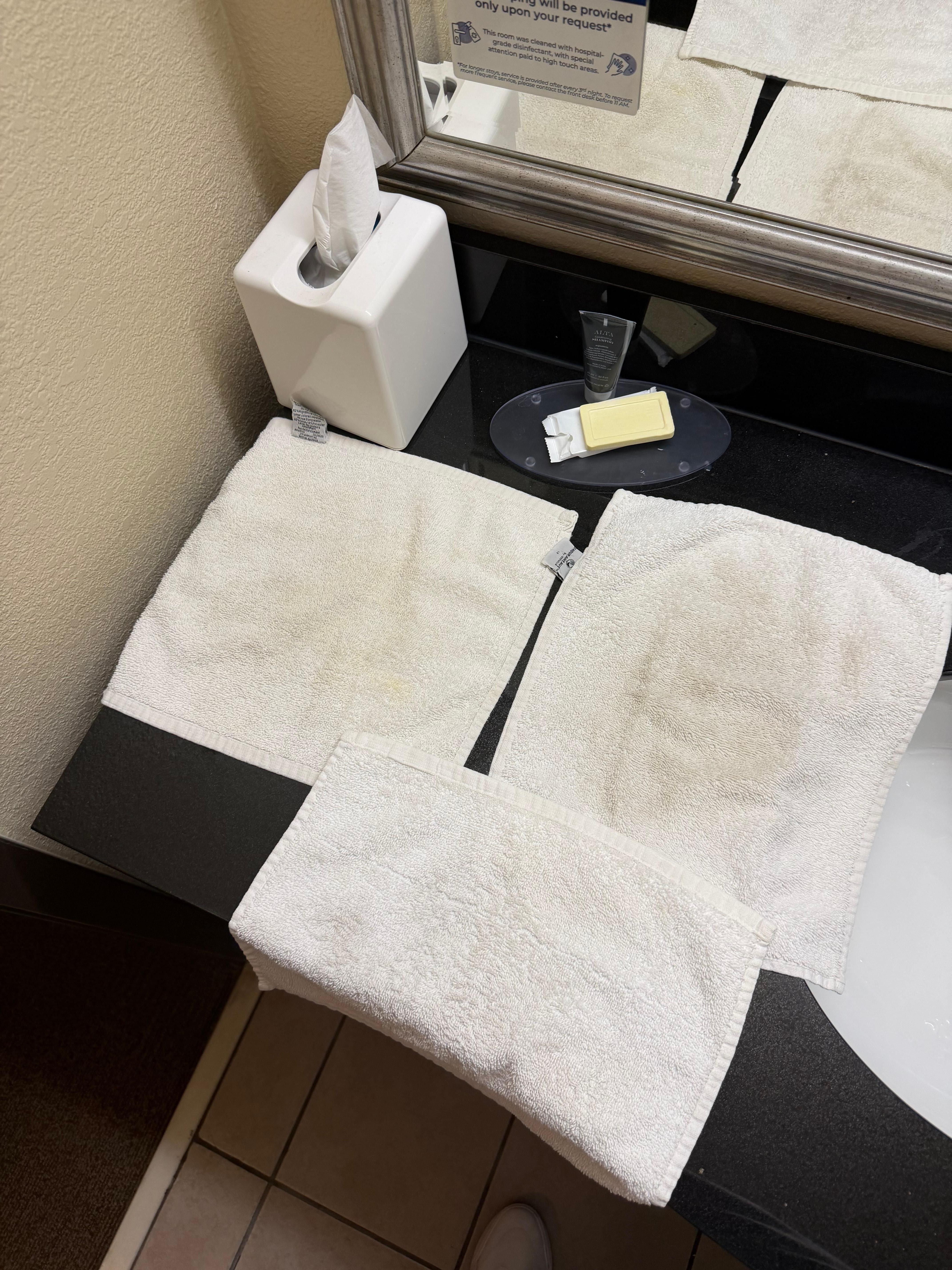 Soiled hand towels in bathroom upon arrival.