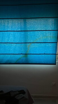Stained window shade.