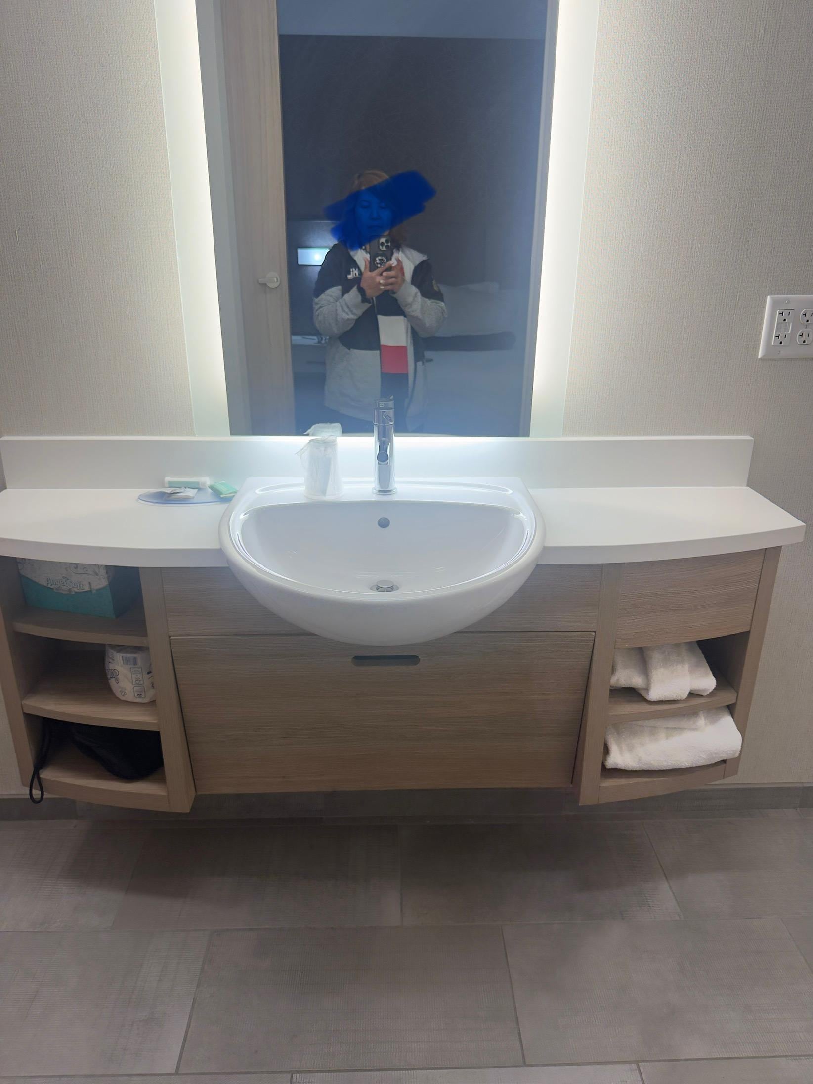 The bathroom counter is too small for a big bathroom. They should add a table and hooks for towels