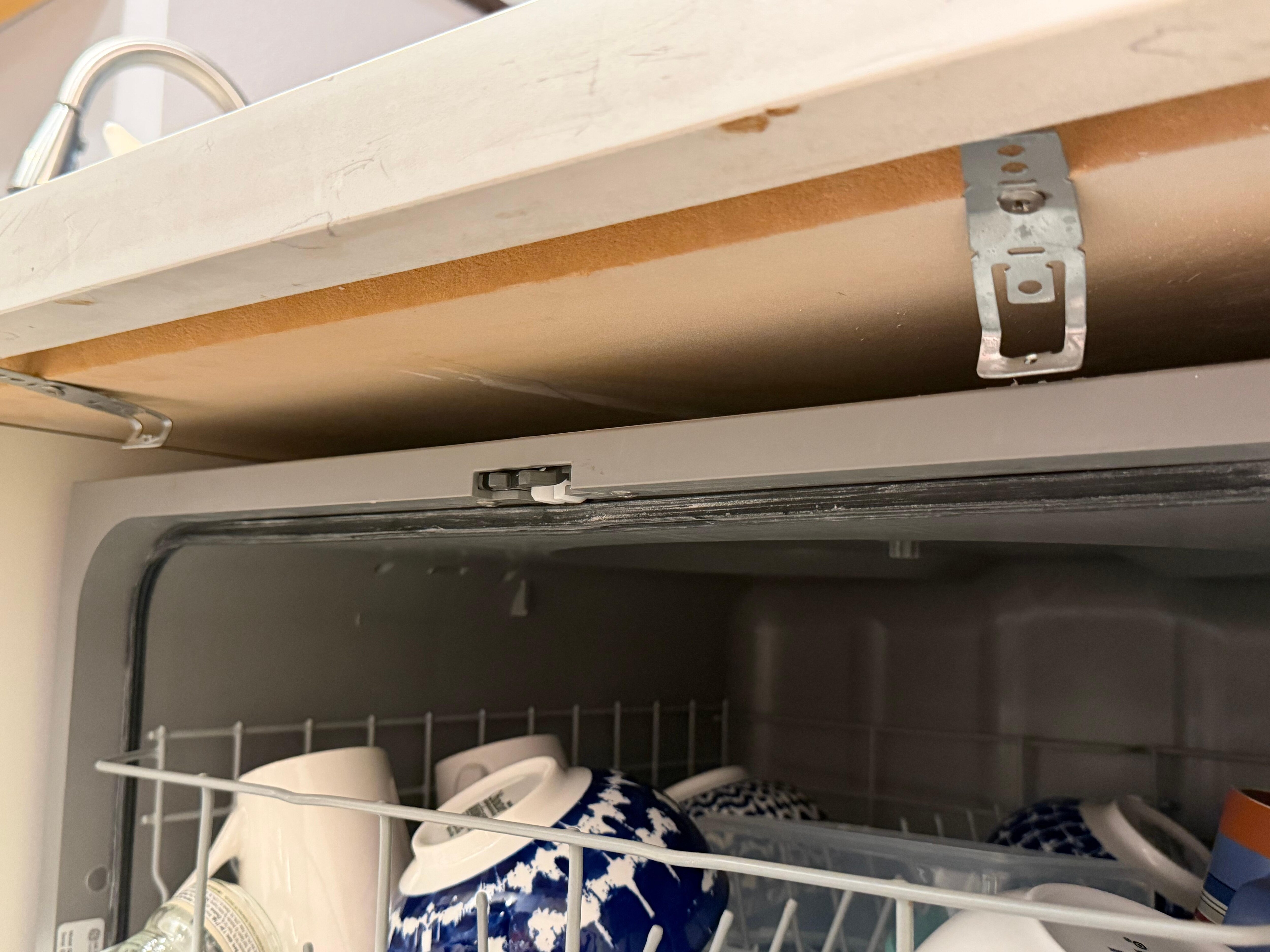 Dishwasher is not attached and tips over when you pull out the racks