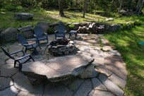 back fire pit with stone bench