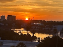 Beautiful sunset from the front door balcony. You can see the sunrise on the other end of the condo through the living room or bedroom windows and balcony. .