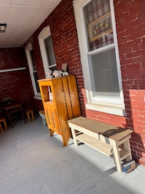 Sunny side porch with outdoor dining area