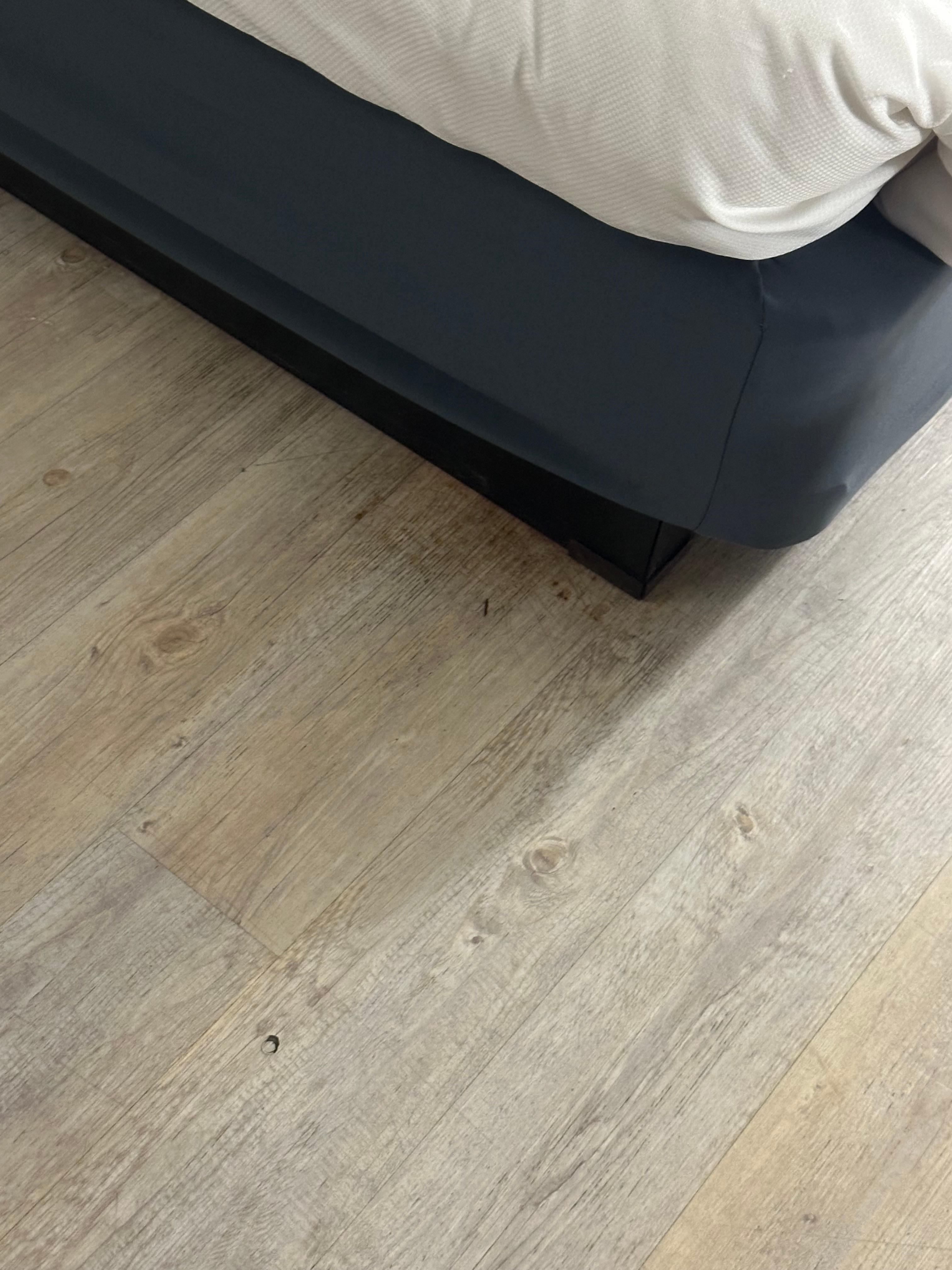 Gross stuff built up around bed in floor 