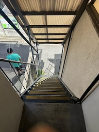 Looking down the stairs from the 2nd floor unit.