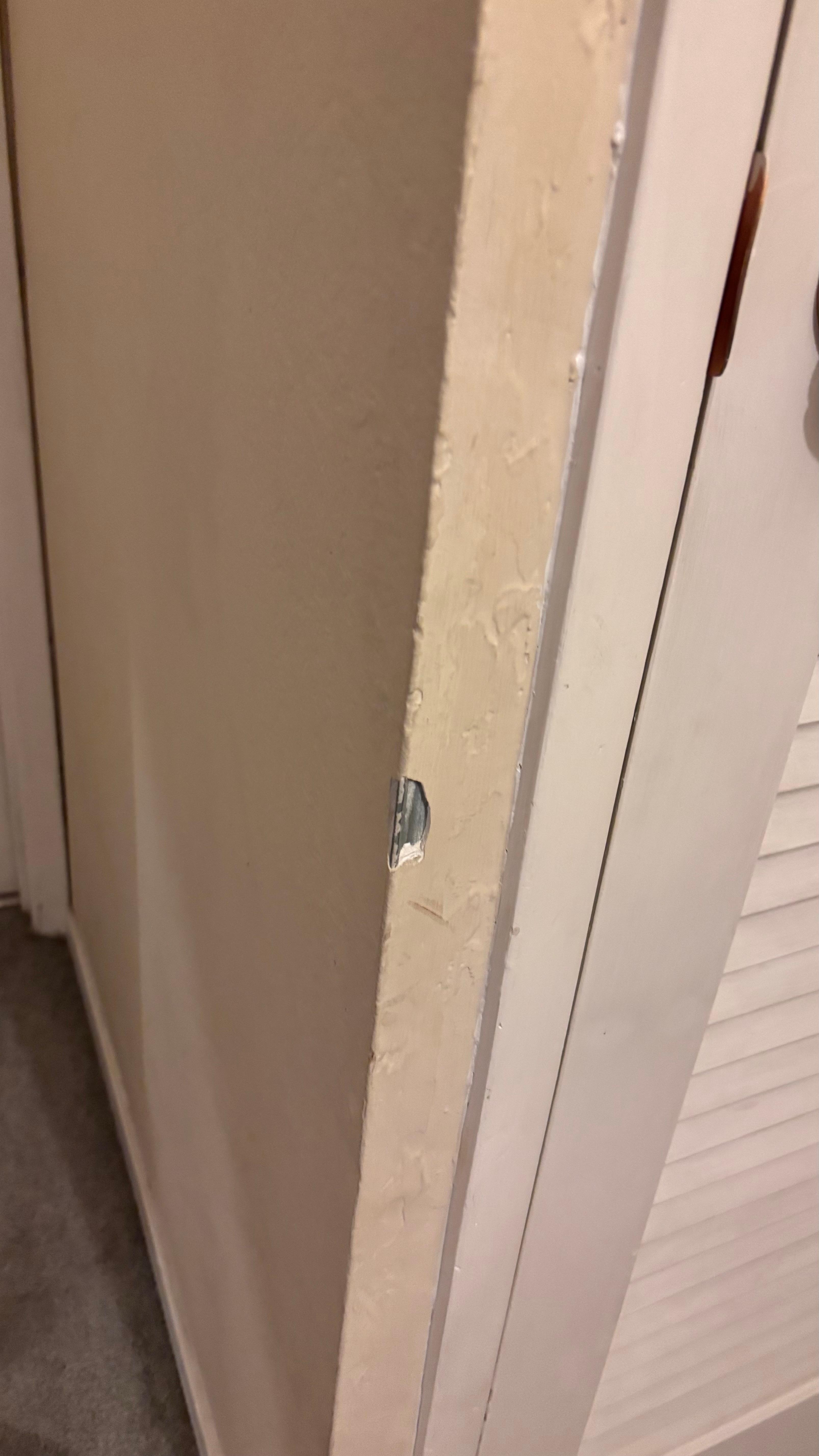 Second floor going to the bathroom has a corner damage