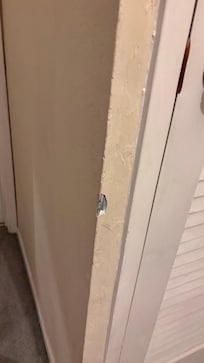Second floor going to the bathroom has a corner damage