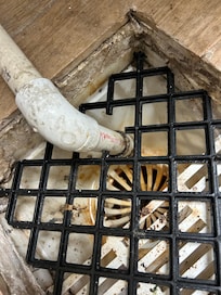 this is on the second floor of this a constant flow of water out of this tube into the pipe, which causes the carpet in the hallway to be very damp and smell very wet. It also has a loud noise coming out of that room.