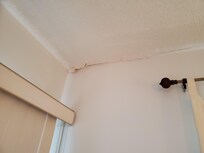 Moisture damage on ceiling in master bedroom