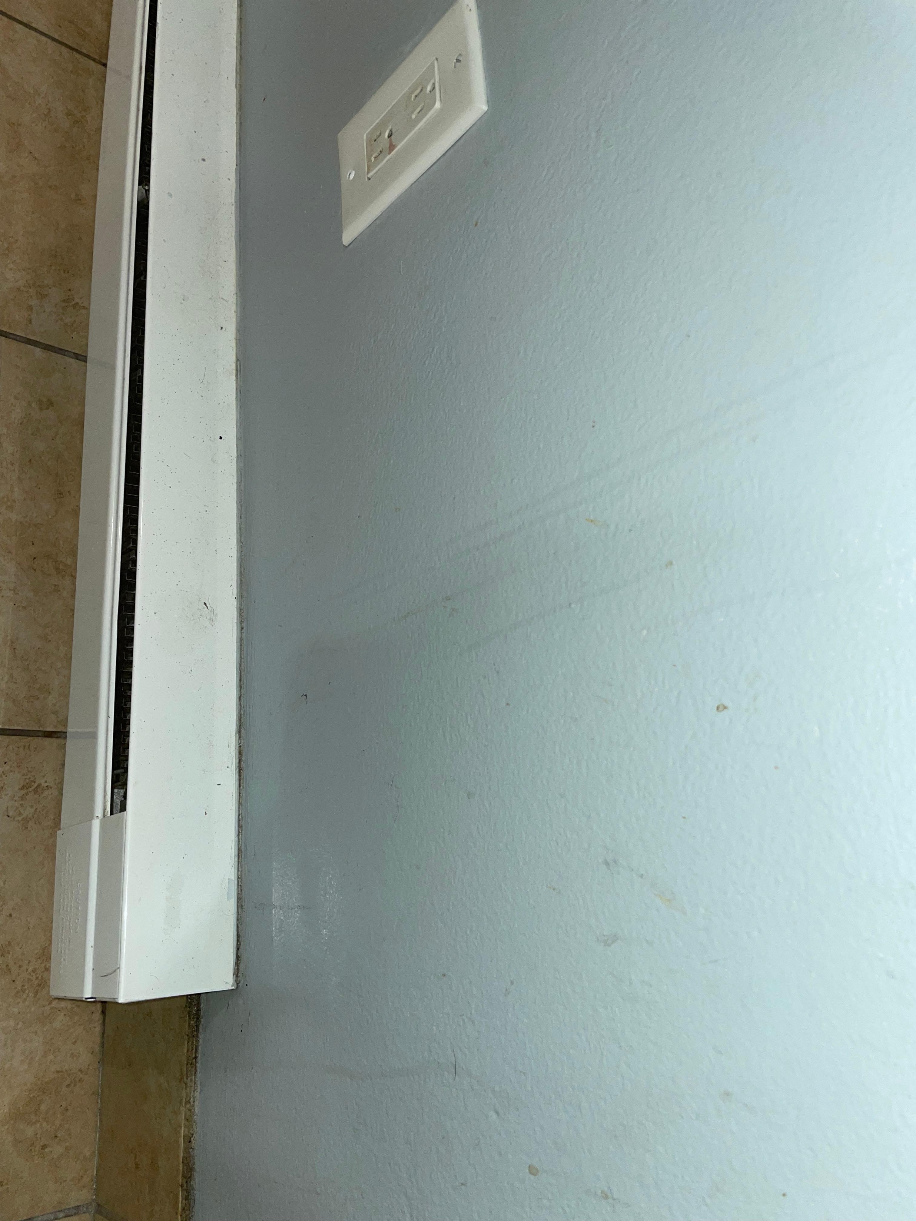 Splatters on wall in kitchen