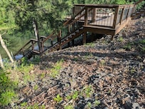 View of the side of the deck and the stairs down to the river area.