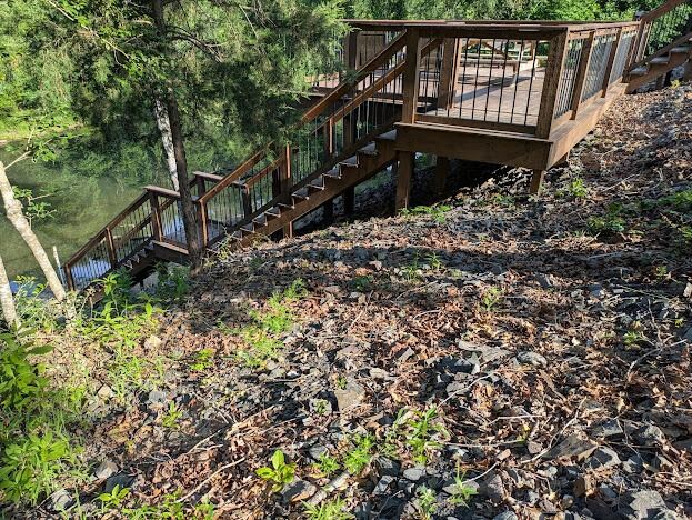 View of the side of the deck and the stairs down to the river area.