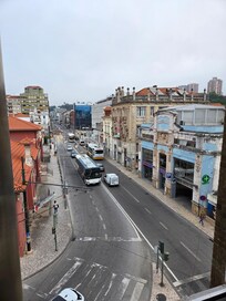 view from our room to front of hotel, parking across the street in the blue building.